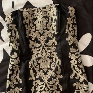 The dress fits a size 6. This is from White House Black Market.